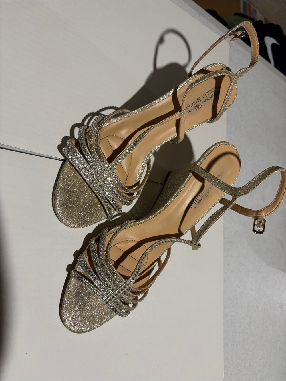 Badgley Mischka from American Glamour! Gold sparkly wedges with rhinestones.